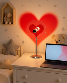 Heart and moon LED projector table lamp with warm ambient light