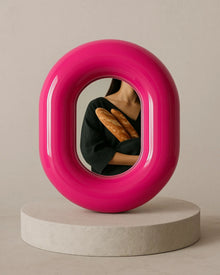 Hot pink donut-shaped makeup mirror for vanity or dressing table