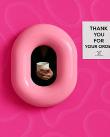 Hot pink donut-shaped makeup mirror for vanity or dressing table