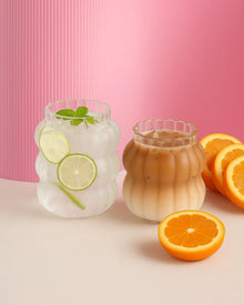 Clear glass coffee cup with matching straw for iced drinks