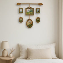 Vintage multi-frame hanging wall art with green and gold frames and landscape artwork