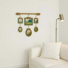 Vintage multi-frame hanging wall art with green and gold frames and landscape artwork