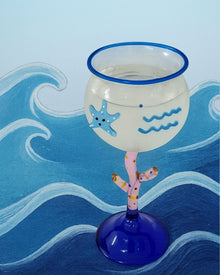 Ocean-inspired wine glass with fish motif and coral-style stem