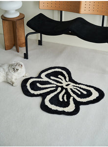 Black and white bowknot area rug with soft tufted texture