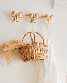 Vintage bow triple wall hook with antique-style finish