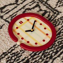 Red grid wall clock with pendulum and retro dot hour markers