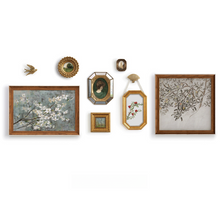 Set of eight vintage-inspired botanical, portrait, and landscape wall art pieces in assorted frames