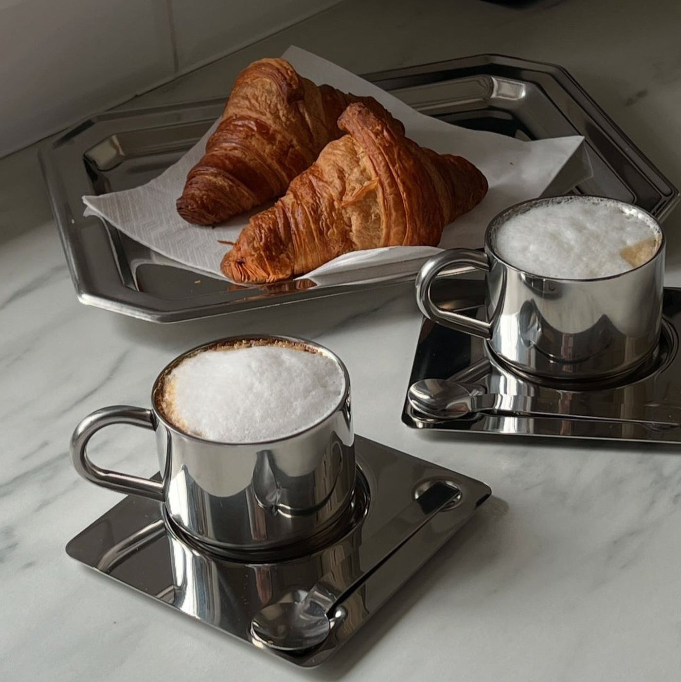 Industrial stainless steel coffee cup set with matching saucer and spoon