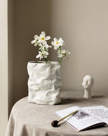 Crumpled ceramic vase with folded paper inspired texture