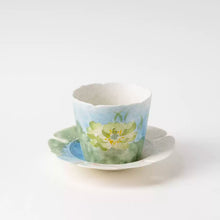 Set of two ceramic lotus tea cups with hand-painted floral design