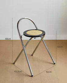 French-inspired walnut rattan folding stool with woven seat