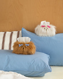 White fluffy dog tissue box cover with decorative bow clips