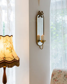 Vintage iron wall mirror with built-in candle holder