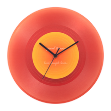 Black vinyl record-inspired clock with stand for wall or tabletop display