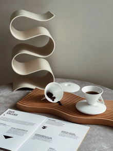 Triangular ceramic espresso cup with matching saucer
