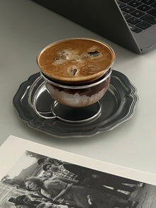 Vintage glass coffee cup with stainless steel wire holder