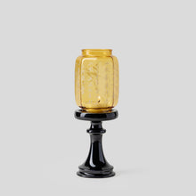 Chinese-inspired glass and ceramic candle holder with decorative nature motifs