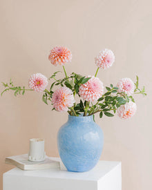 Foggy handcrafted blue glass vase with textured surface