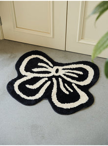 Black and white bowknot area rug with soft tufted texture
