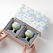 Set of two ceramic lotus tea cups with hand-painted floral design