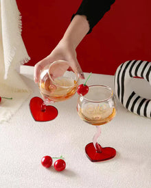 Set of two heart base wine glasses with curved stems
