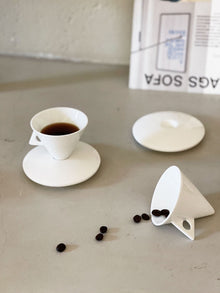 Triangular ceramic espresso cup with matching saucer