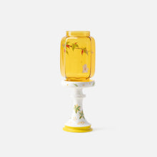 Chinese-inspired glass and ceramic candle holder with decorative nature motifs