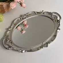 French vintage vanity mirror with ornate gold-tone frame