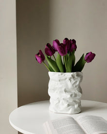 Crumpled ceramic vase with folded paper inspired texture