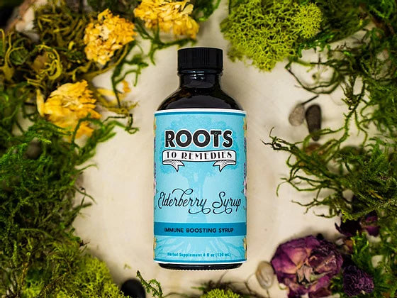 Bottle of organic elderberry herbal syrup with raw honey