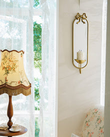 Vintage iron wall mirror with built-in candle holder