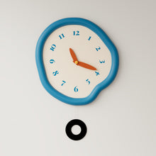 White asymmetrical drip wall clock with a playful melting-inspired shape