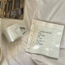 Notebook-inspired ceramic coffee cup with matching tray
