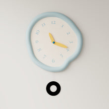 White asymmetrical drip wall clock with a playful melting-inspired shape