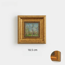 Set of eight vintage-inspired botanical, portrait, and landscape wall art pieces in assorted frames