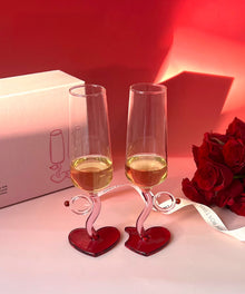 Set of two heart base wine glasses with curved stems
