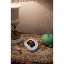 White lying charging dock for Gondosóra magnetic charging cable
