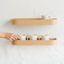 Set of two natural oak floating wall shelves for minimalist home storage and display