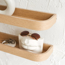 Set of two natural oak floating wall shelves for minimalist home storage and display