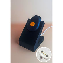 White standing Gondosóra charging dock for original magnetic charging cable