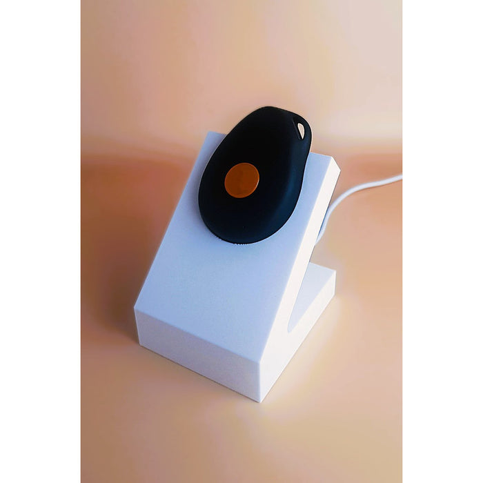 White standing Gondosóra charging dock for original magnetic charging cable