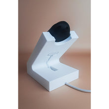 White standing Gondosóra charging dock for original magnetic charging cable
