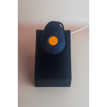 White standing Gondosóra charging dock for original magnetic charging cable