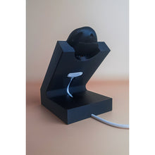 White standing Gondosóra charging dock for original magnetic charging cable