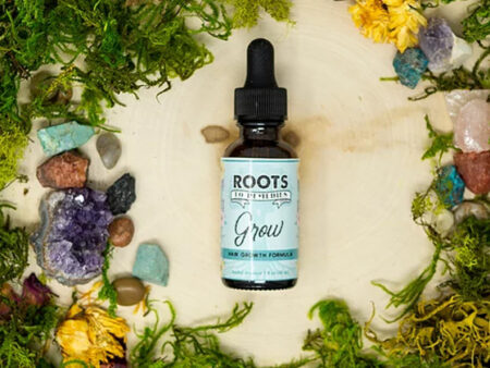 Bottle of herbal hair and scalp oil for nourishing pre-wash hair care