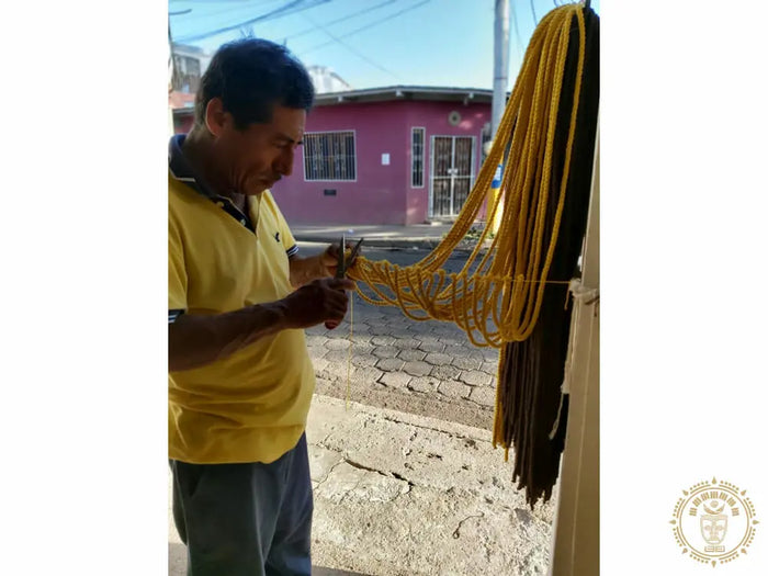 Yellow Estelí Deluxe L-bar cotton hammock with wooden spreader bars and decorative fringe