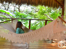 Hand-woven Deluxe Masaya cotton spreader bar hammock with decorative fringe and wooden bars
