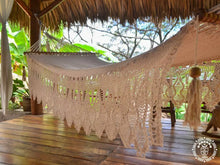 Hand-woven Deluxe Masaya cotton spreader bar hammock with decorative fringe and wooden bars