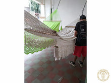 Hand-woven Deluxe Masaya cotton spreader bar hammock with decorative fringe and wooden bars