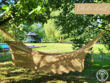 Handwoven León Deluxe L-bar cotton hammock with wooden spreader bars and decorative fringe